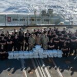 Members of HMCS Harry DeWolf and its embarked United States Law Enforcement Detachment pose with narcotics that were seized during Operation CARIBBE on March 1, 2025. Credit: National Defence / Canadian Armed Forces