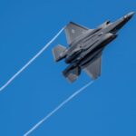 A U.S. F-35 fighter jet flies over the Eifel Mountains near Spangdahlem, Germany. Canada is looking at its options as it has already ordered 88 of the American-made aircraft. (Harald Tittel/The Associated Press)