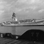 This Dec. 1969 view of the last sail past of HMCS Bonaventure in Halifax Harbour shows the beautiful lines of this updated design. Credit Library and Archives Canada / Department of National Defence HS 69-3061 Crown Copyright.