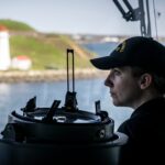A ship's officer monitors the ship's track as HMCS William Hall departs Halifax Harbour on Wednesday May 14, 2025.