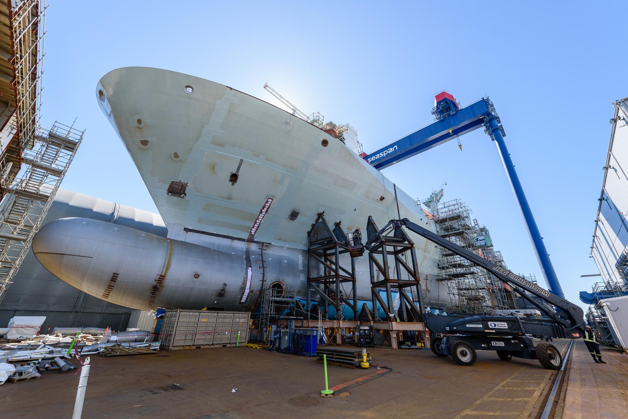 Close-up view of the bow section of the future HMCS Protecteur during advanced construction and outfitting at Seaspan Vancouver Shipyards.