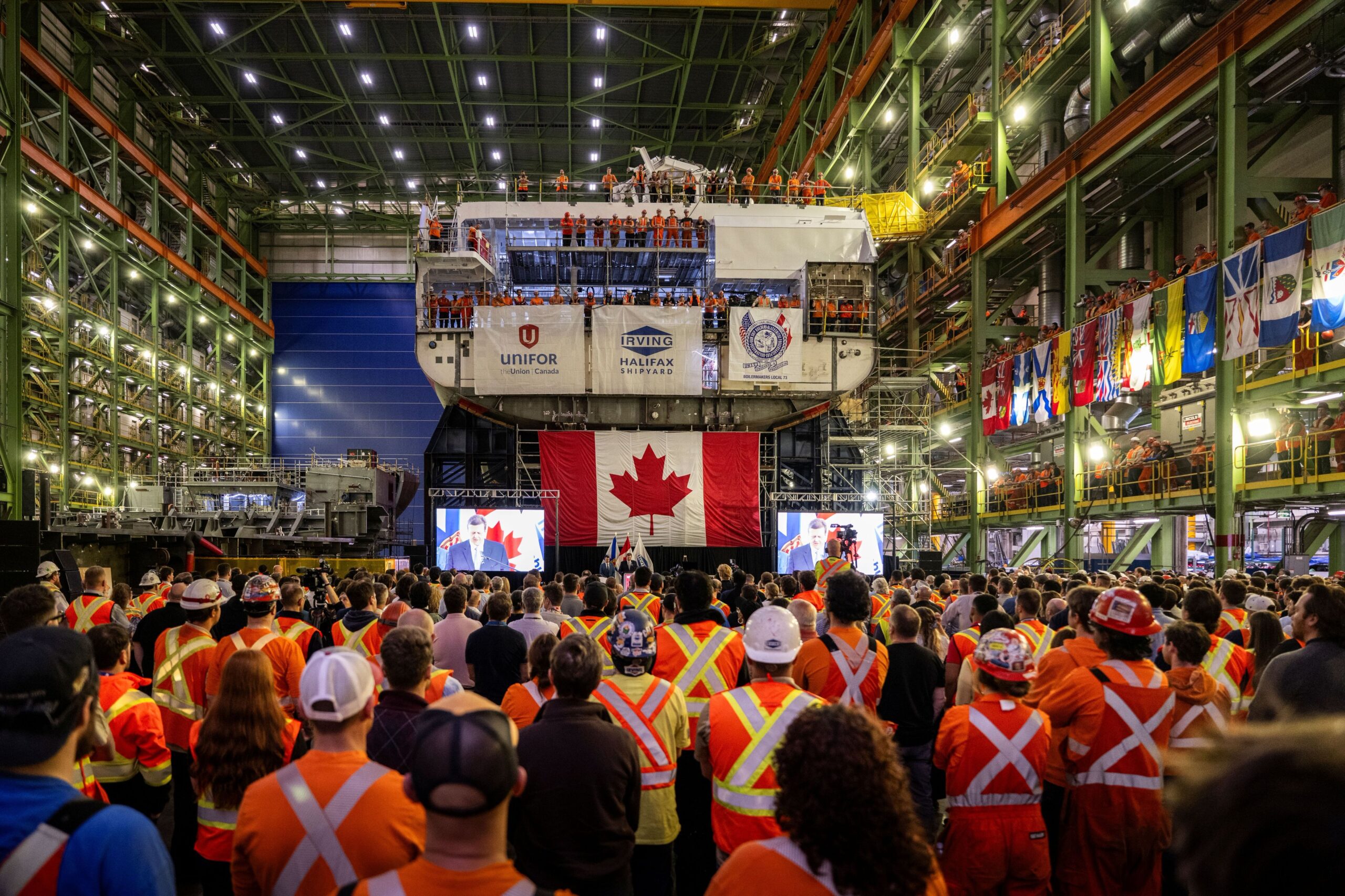 Workers gather for the ceremony at Irving Shipbuilding, Halifax, NS.