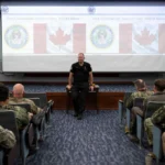 Canadian Royal Navy Rear Adm. D.E. Mazur, vice commander, U.S. 2nd Fleet, gives opening remarks during the Fall 2026 Theater Undersea Warfare Symposium, held at Naval Support Activity - Hampton Roads, Aug. 25, 2026.