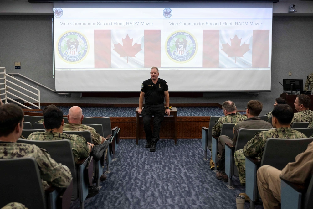 Canadian Royal Navy Rear Adm. D.E. Mazur, vice commander, U.S. 2nd Fleet, gives opening remarks during the Fall 2026 Theater Undersea Warfare Symposium, held at Naval Support Activity - Hampton Roads, Aug. 25, 2026.