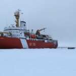 Crew members of the CCGS Louis S. St-Laurent gathered on the Arctic sea ice. (Submitted by the Canadian Coast Guard)