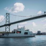 Bound for Arctic waters on #OpNANOOK-Tuugaalik, HMCS Robert Hampton Gray transits beneath the Angus L. McDonald Bridge on her way out of Halifax, NS.