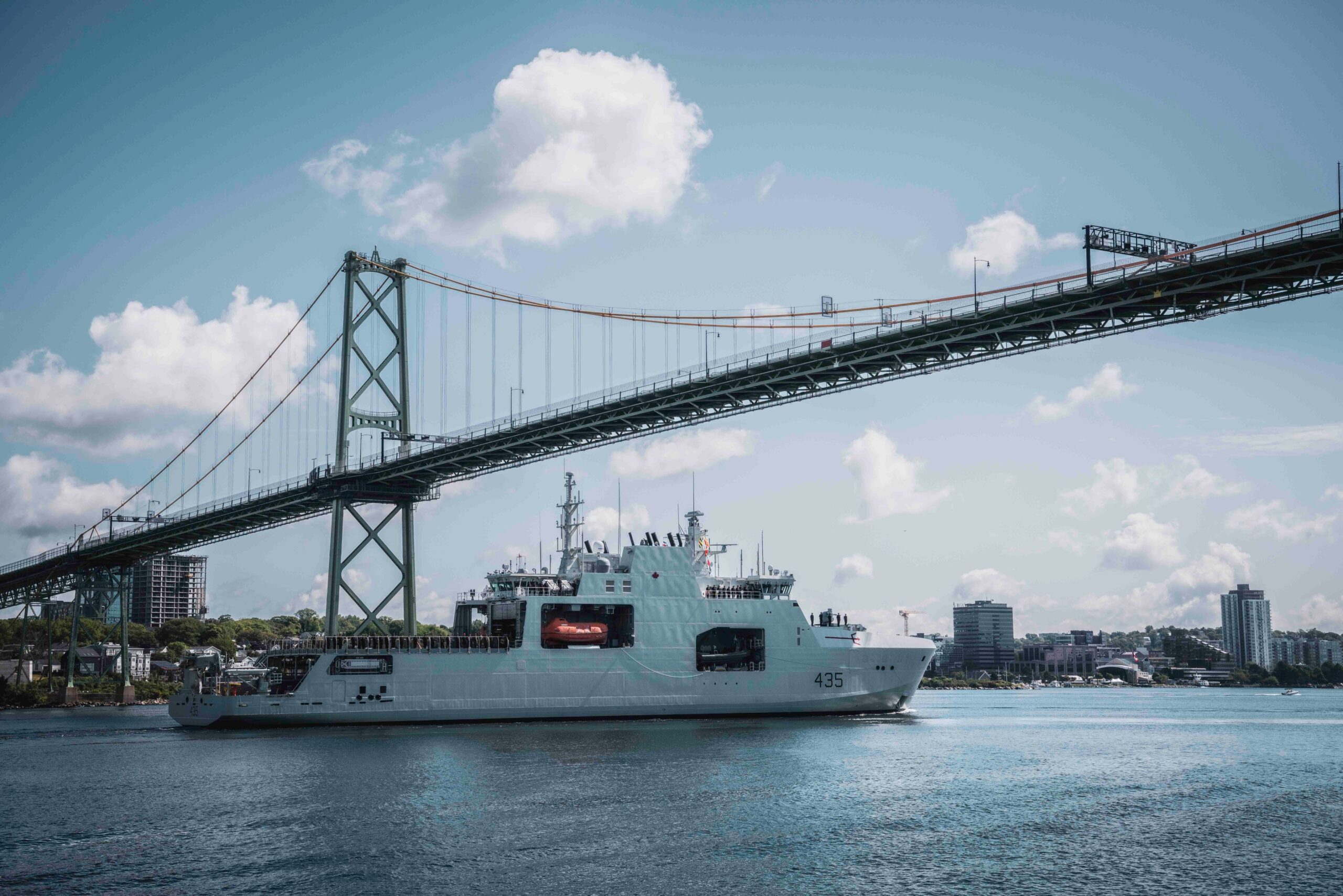 Bound for Arctic waters on #OpNANOOK-Tuugaalik, HMCS Robert Hampton Gray transits beneath the Angus L. McDonald Bridge on her way out of Halifax, NS.