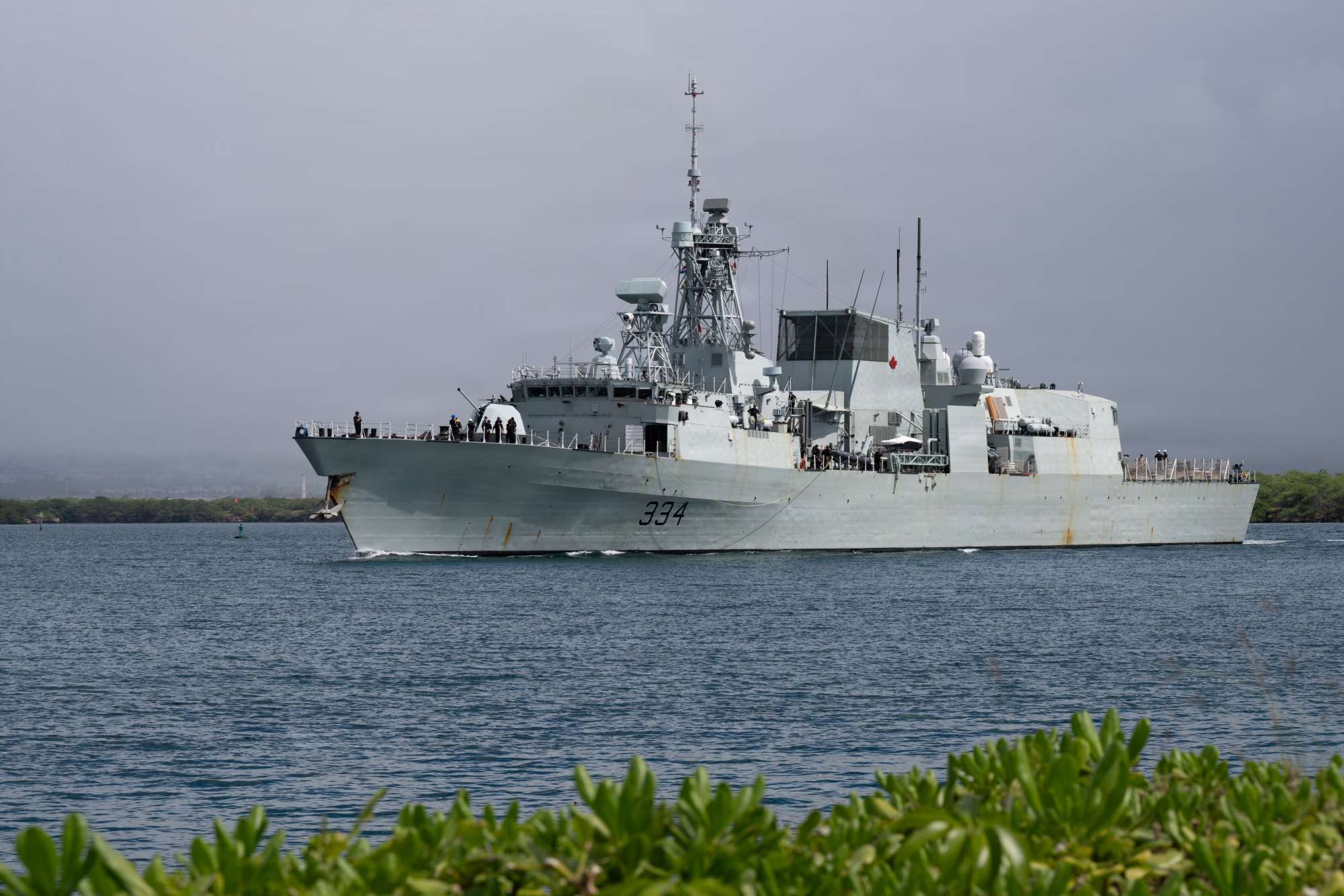Royal Canadian Navy Halifax-class frigate HMCS Regina (FFH 334) departs Joint Base Pearl Harbor-Hickam, Hawaii, to commence the sea phase of Exercise Rim of the Pacific (RIMPAC) 2026, July 6.
